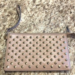 Gold studded blush colored Michael kors wristlet